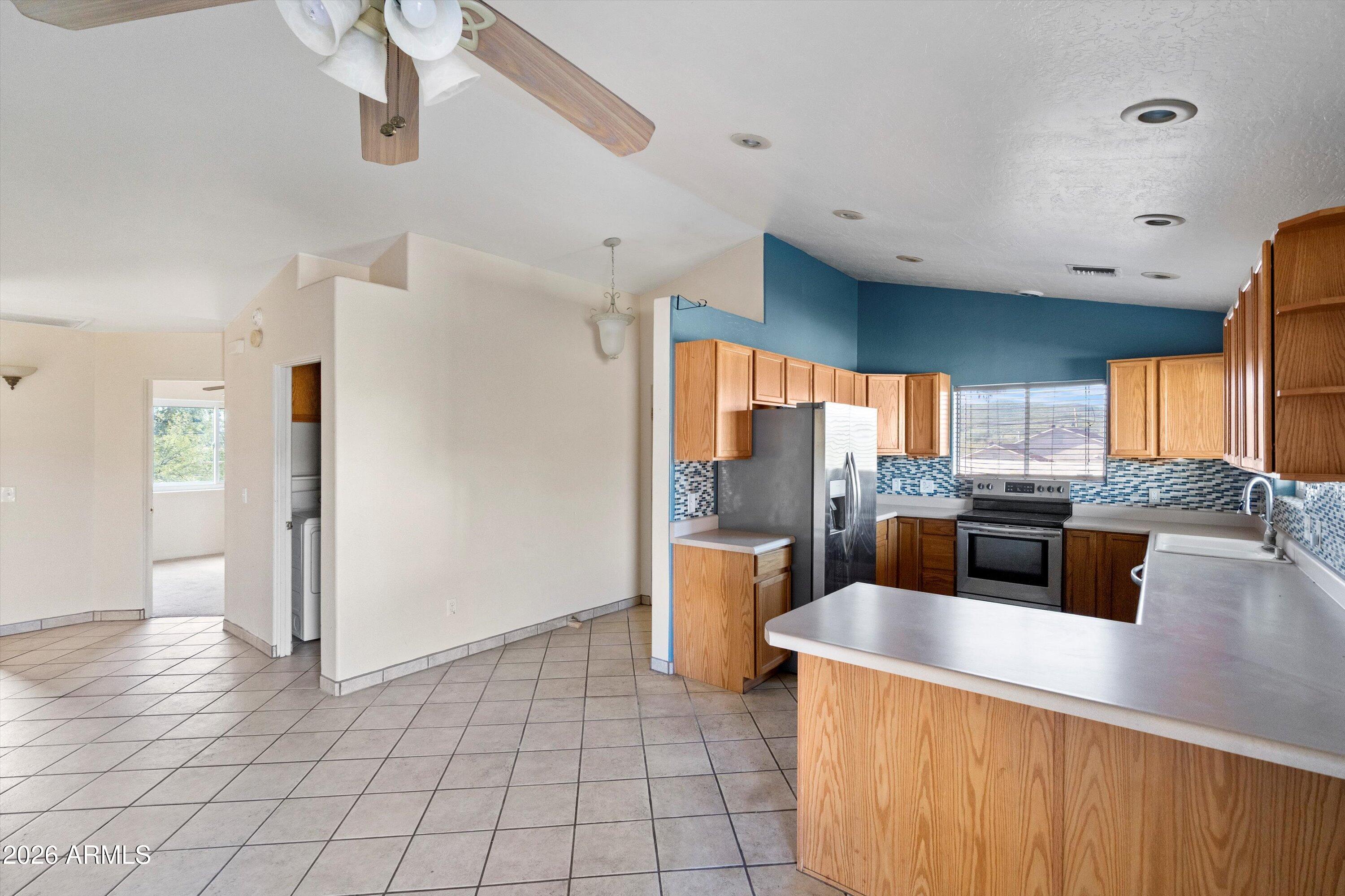 51224 North Mockingbird Road Wickenburg, AZ 85390 - Photo 6 of 31 06-Family Room to Kitchen
