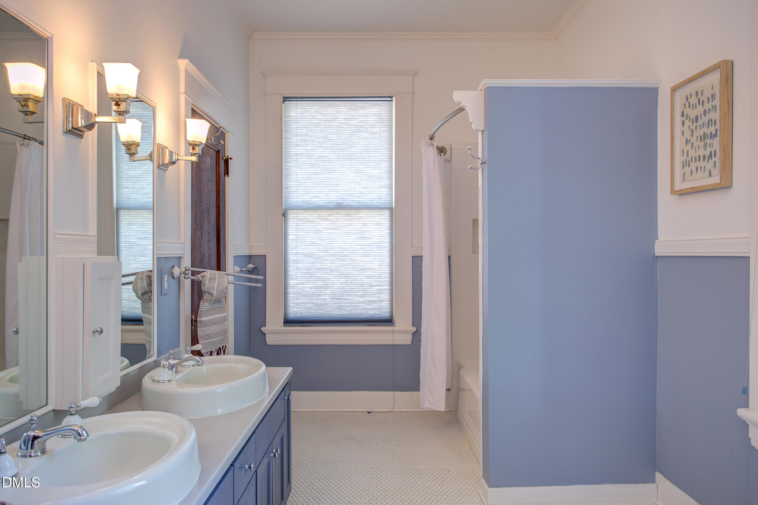 127 Forest Road Raleigh, NC 27605 - Photo 50 of 75 a bathroom with a tub sink and mirror