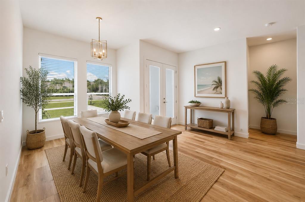 1215 Rio De Janeiro Avenue Punta Gorda, FL 33983 - Photo 10 of 65 a view of a dining room with furniture window and wooden floor