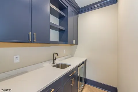 a view of a sink and cabinets