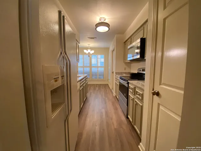 a view of a livingroom with a staircase