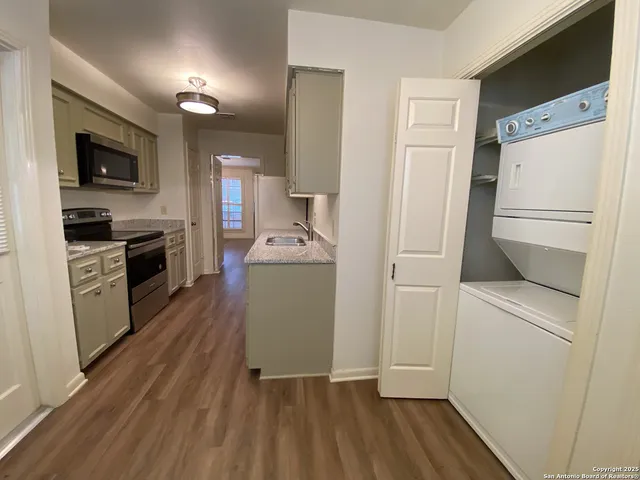 wooden floor in an empty room with a mirror