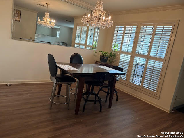 165 West Rampart Drive, Unit 205 San Antonio, TX 78216 - Photo 15 of 34 a view of a dining room with furniture window and wooden floor