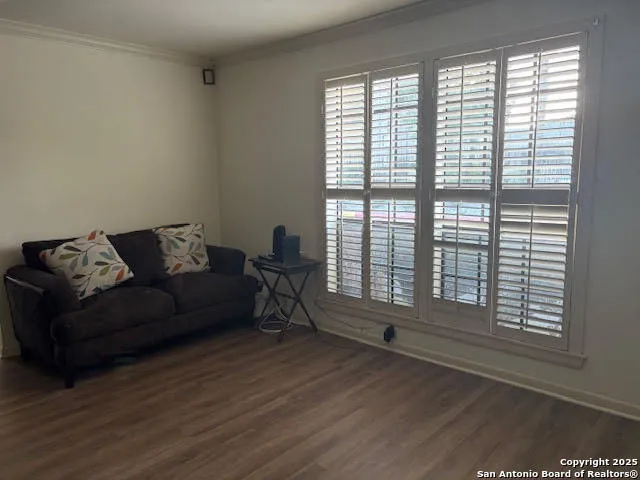 a view of a chandelier in a room with wooden floor