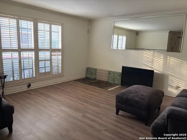 a view of a livingroom with furniture and wooden floor