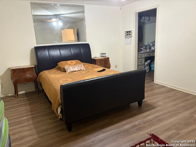 165 West Rampart Drive, Unit 205 San Antonio, TX 78216 - Photo 22 of 34 a bed sitting in a bedroom next to a cabinet