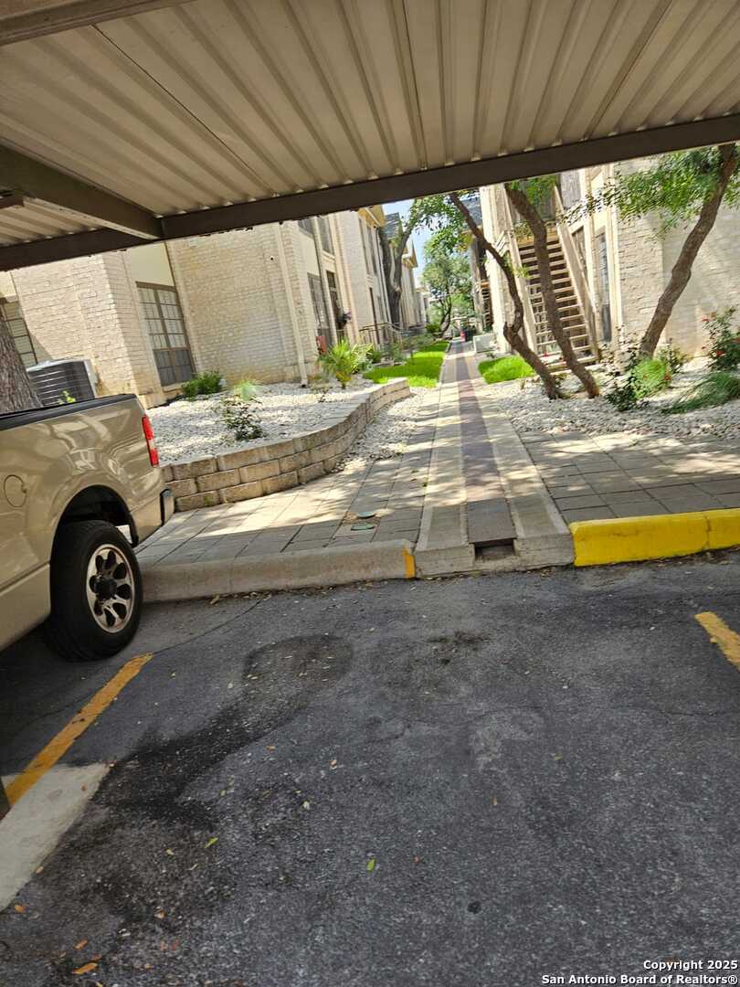 165 West Rampart Drive, Unit 205 San Antonio, TX 78216 - Photo 34 of 34 a view of yard with car parked