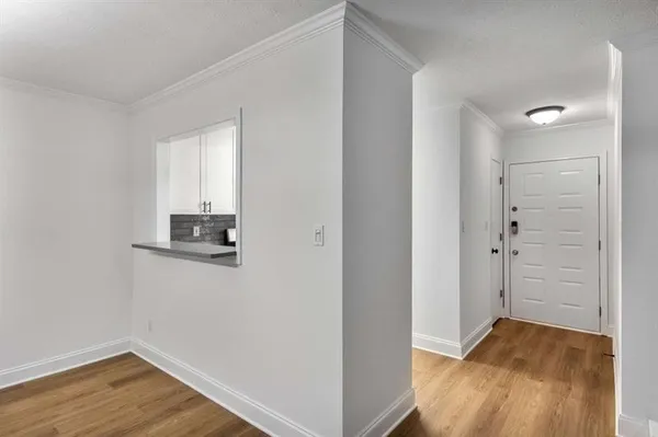 a view of storage and utility room in wooden floor