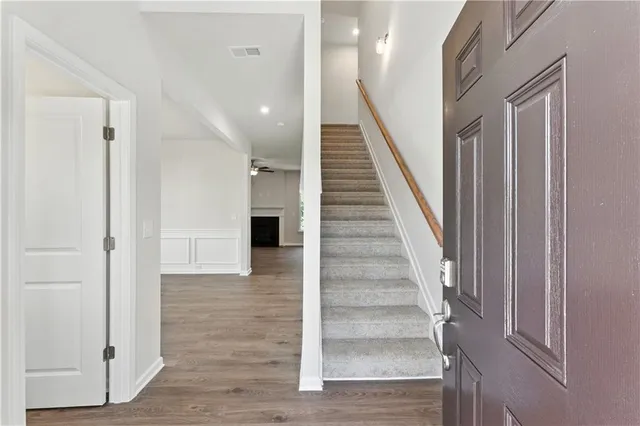 a bathroom with a sink a mirror and a toilet