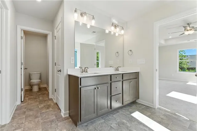 a bathroom with a double vanity sink and a mirror