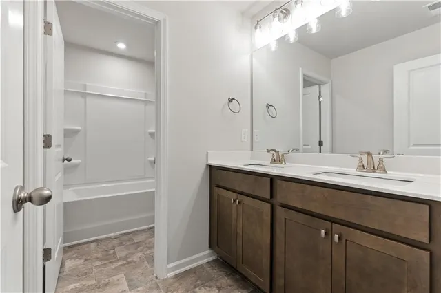 a bathroom with a toilet and a bathtub