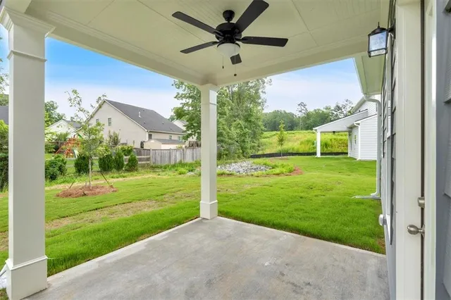 a view of a big room with a big yard and potted plants