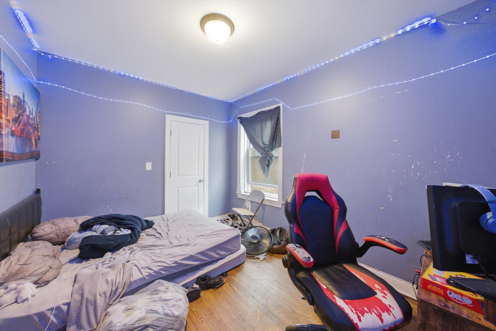 6837 South Morgan Street Chicago, IL 60621 - Photo 15 of 24 a bedroom with a bed and a chair