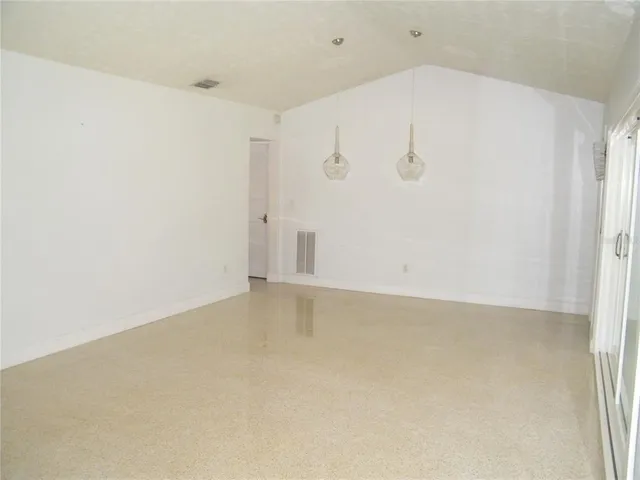 an empty room with a bench