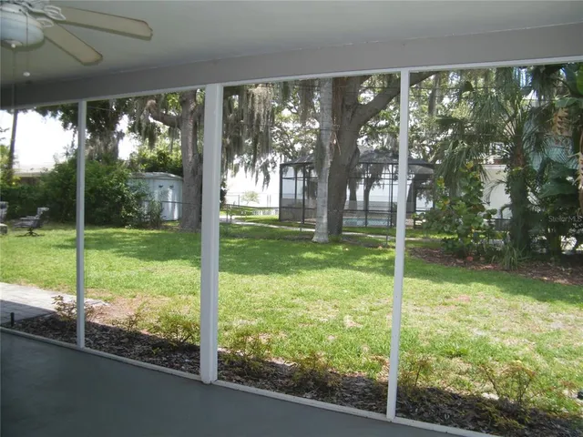 a view of a house and backyard from a living room