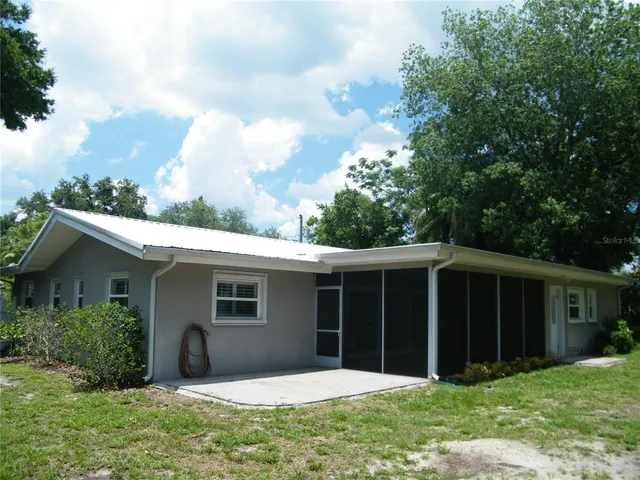 a house that has a big yard in front of it