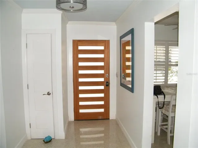 a view of hallway with windows