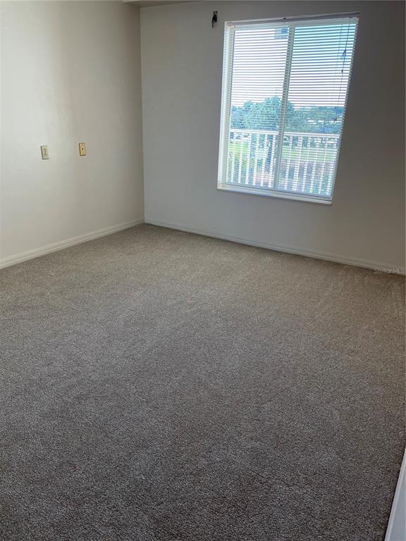 1420 Huntington Lane, Unit 2502 Rockledge, FL 32955 - Photo 12 of 23 an empty room with a window