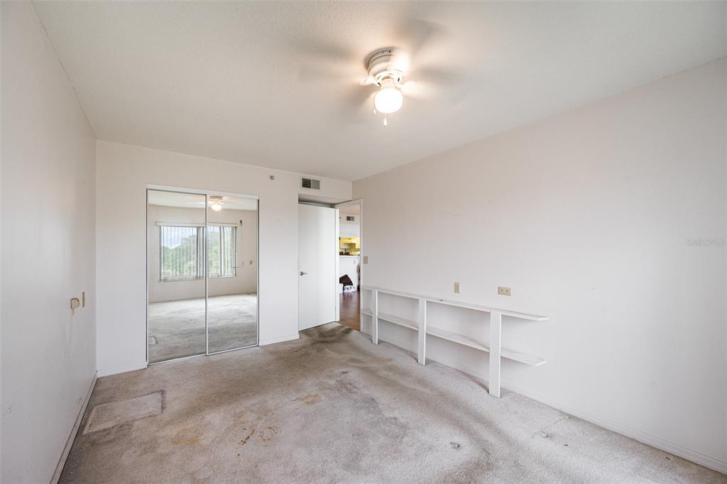 1420 Huntington Lane, Unit 2502 Rockledge, FL 32955 - Photo 16 of 26 an empty room with closet and windows