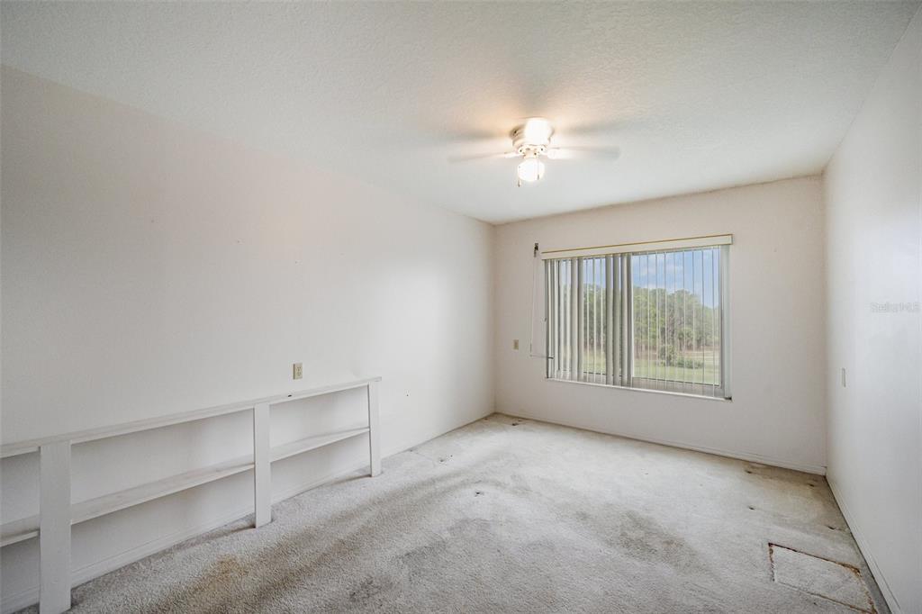 1420 Huntington Lane, Unit 2502 Rockledge, FL 32955 - Photo 17 of 26 a view of an empty room with a window
