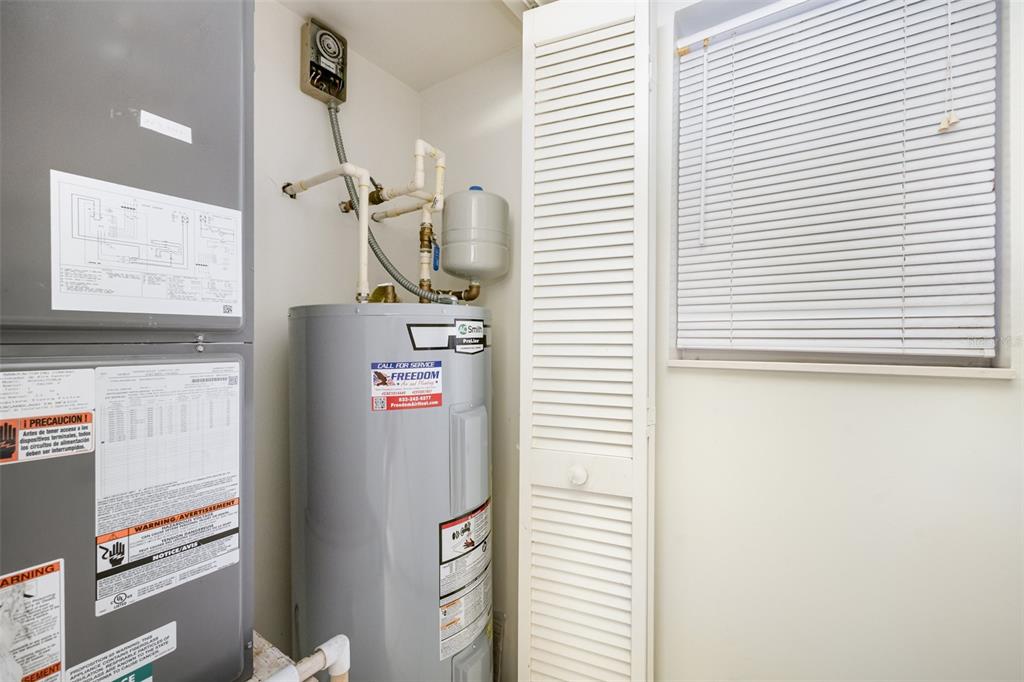 1420 Huntington Lane, Unit 2502 Rockledge, FL 32955 - Photo 17 of 23 a room with refrigerator and window