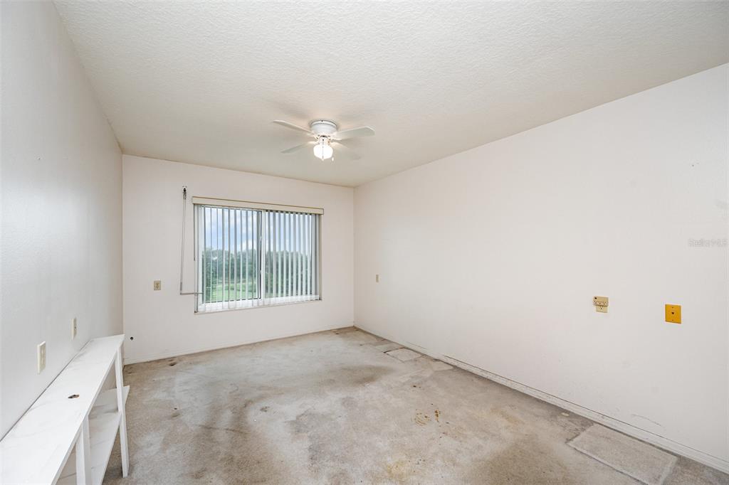 1420 Huntington Lane, Unit 2502 Rockledge, FL 32955 - Photo 18 of 26 an empty room with windows