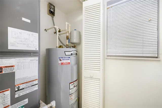 a room with refrigerator and window