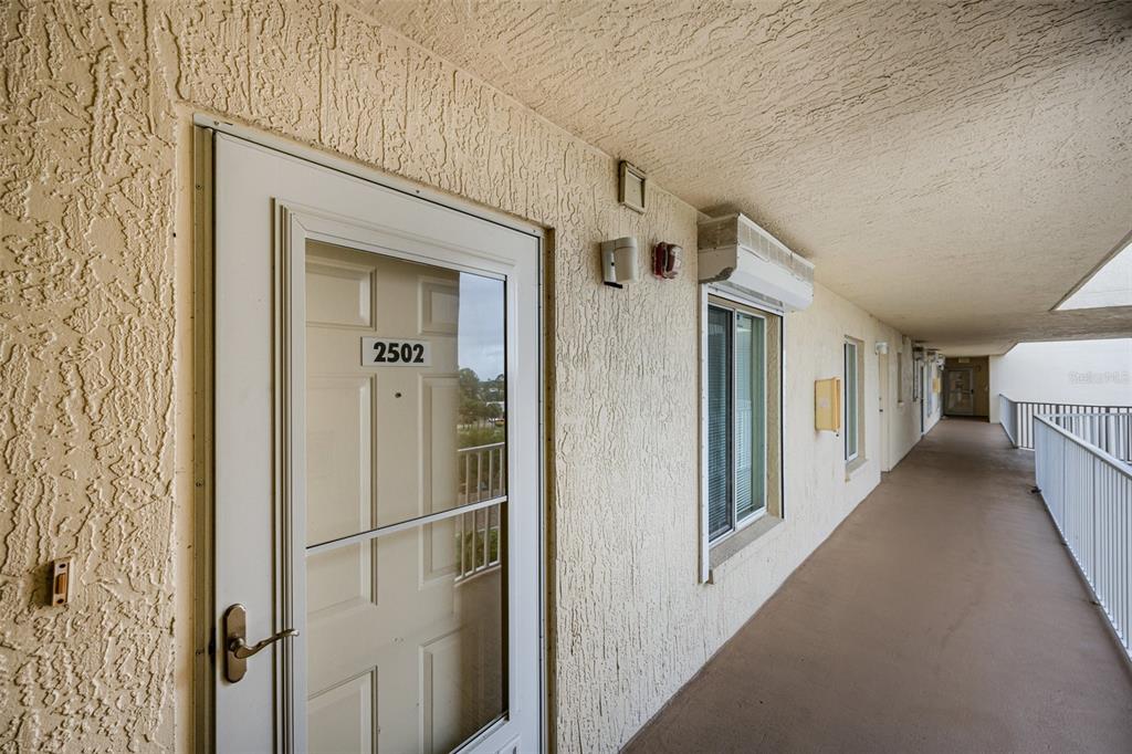 1420 Huntington Lane, Unit 2502 Rockledge, FL 32955 - Photo 3 of 26 a view of a hallway with a white walls
