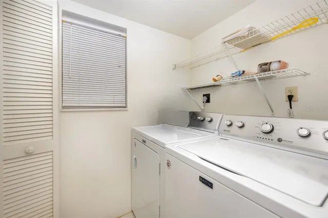a utility room with dryer and washer