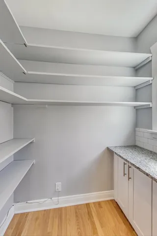 a view of storage and utility room with empty racks