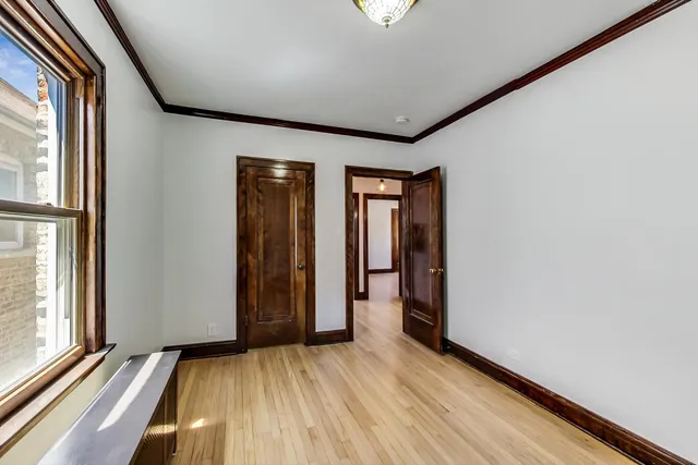 a view of an empty room with glass door