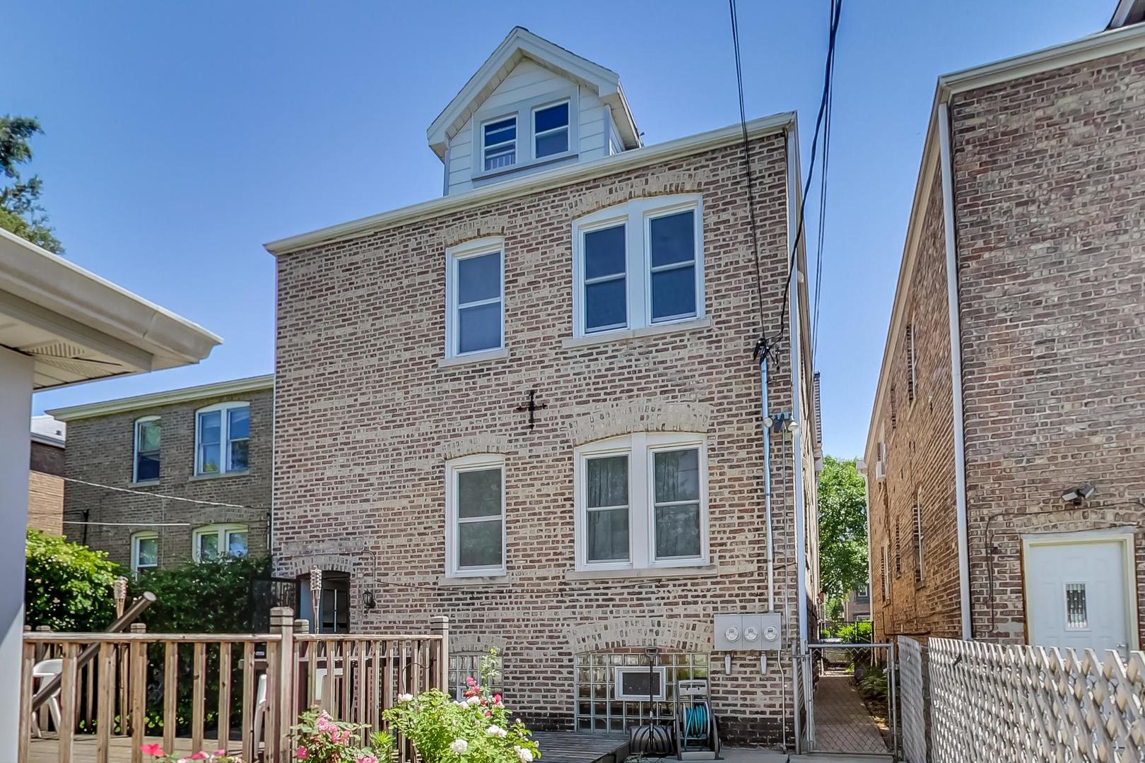 1814 Wesley Avenue, Unit 1 Berwyn, IL 60402 - Photo 20 of 26 a front view of a house with a garden