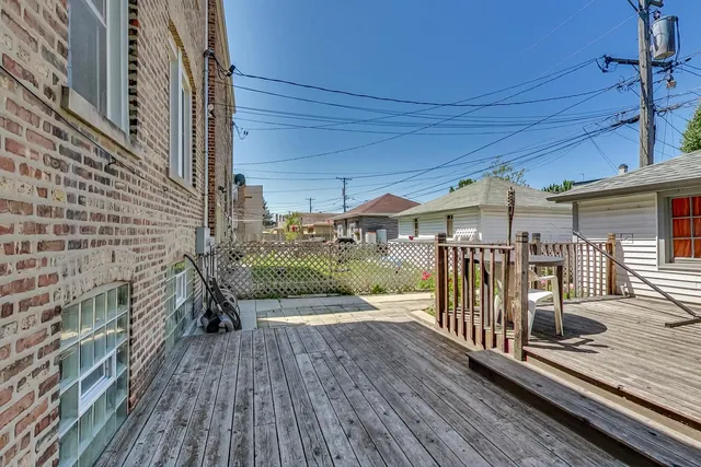 a view of a balcony with wooden floor