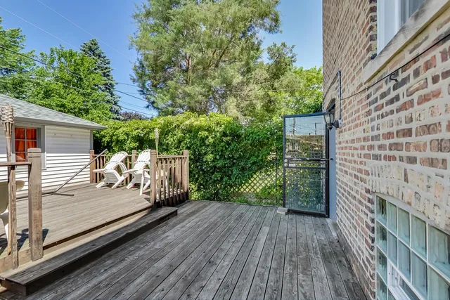 a view of a backyard with sitting area
