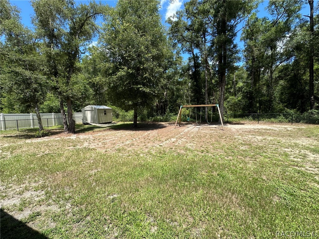 8434 North Vardon Road Citrus Springs, FL 34434 - Photo 26 of 29 Huge backyard (swings do not stay)