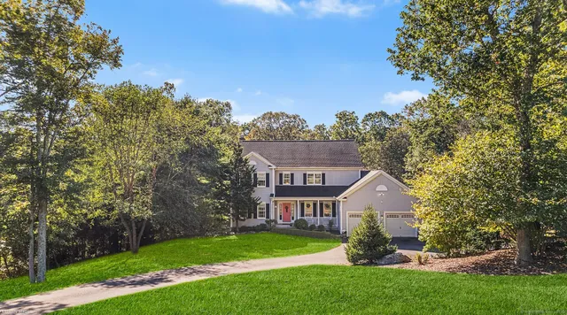 aerial view of a house with a yard