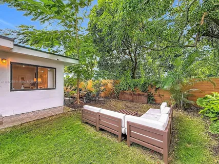 a view of a bench in the backyard
