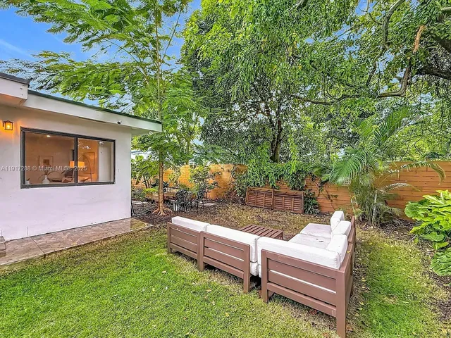 a view of a bench in the backyard