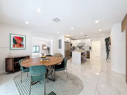 a view of a dining room with furniture