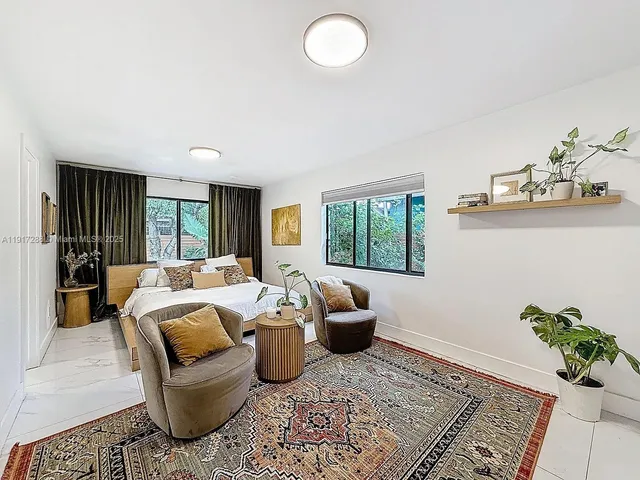 a bed room with furniture and a window