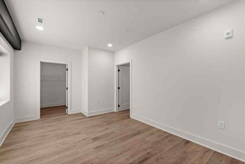 108 Park Place, Unit 107 Decatur, GA 30030 - Photo 16 of 31 a view of hallway with wooden floor
