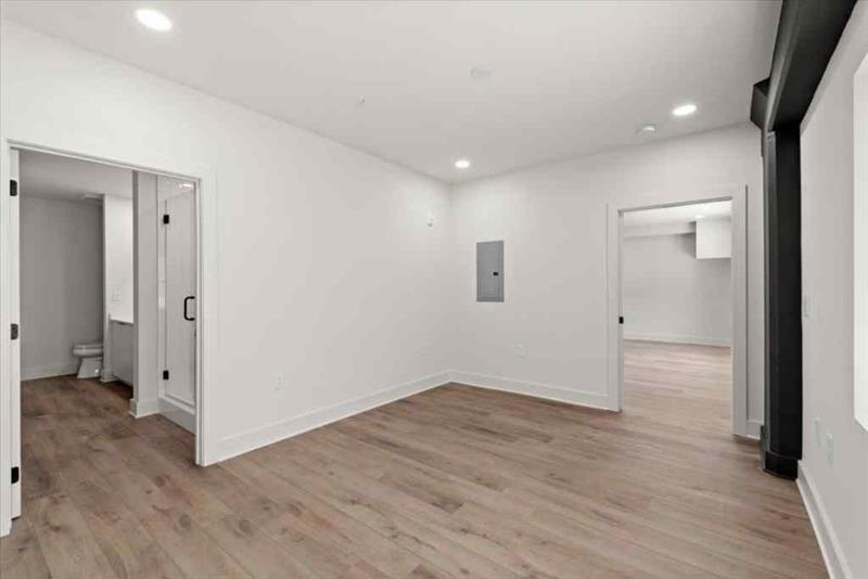 108 Park Place, Unit 107 Decatur, GA 30030 - Photo 17 of 31 wooden floor in an empty room with a window