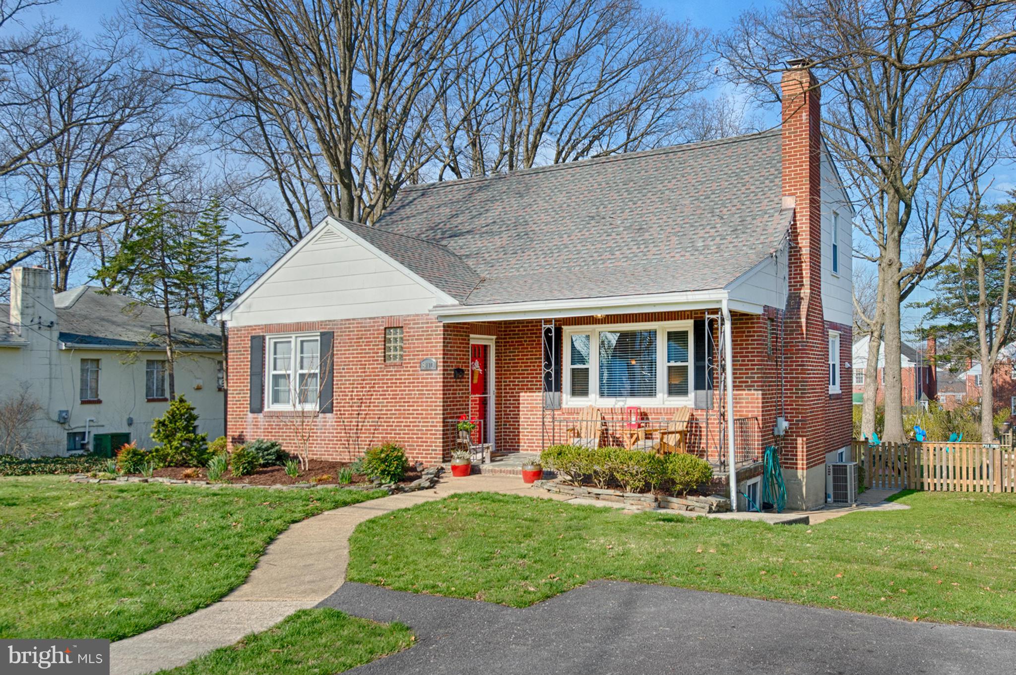 8110 Hillendale Road Baltimore, MD 21234 - Photo 1 of 30 a front view of a house with a yard and potted plants