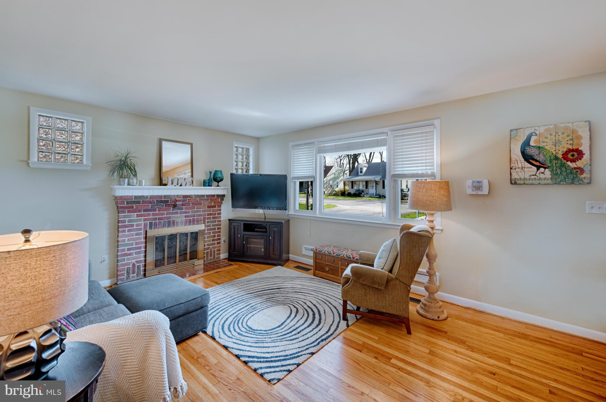 8110 Hillendale Road Baltimore, MD 21234 - Photo 12 of 30 a living room with furniture and a fireplace