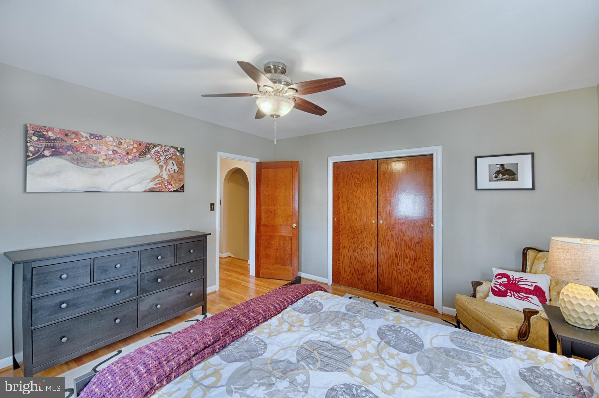 8110 Hillendale Road Baltimore, MD 21234 - Photo 19 of 30 a bedroom with a bed and wooden floor