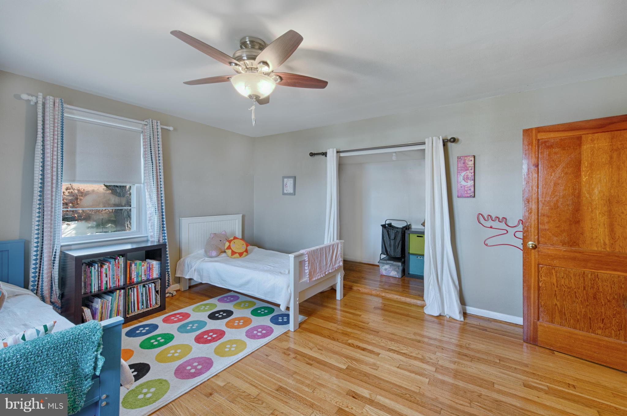 8110 Hillendale Road Baltimore, MD 21234 - Photo 23 of 30 a bedroom with furniture and a book shelf