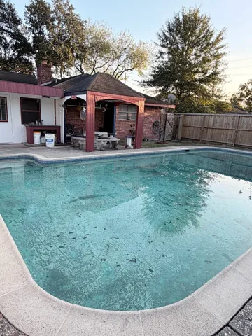 a view of a house with a yard porch and sitting area