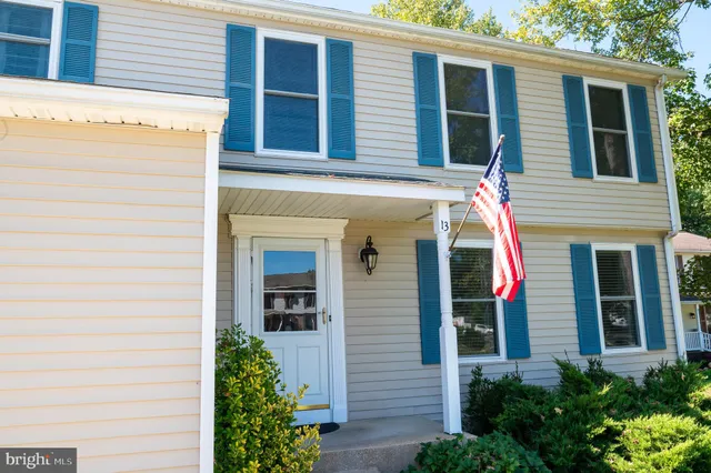 a view of a house with potted plants