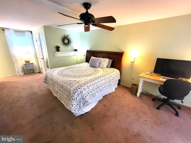 a bed room with a bed and a window