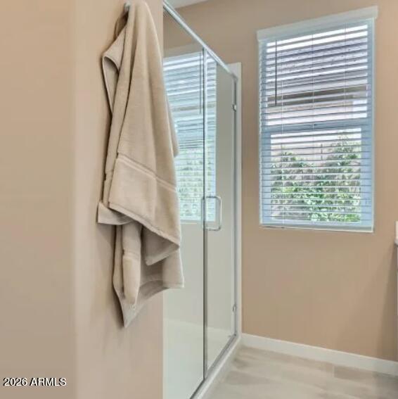 15602 West Miami Street Goodyear, AZ 85338 - Photo 10 of 25 a view of a room that has a window and a shower